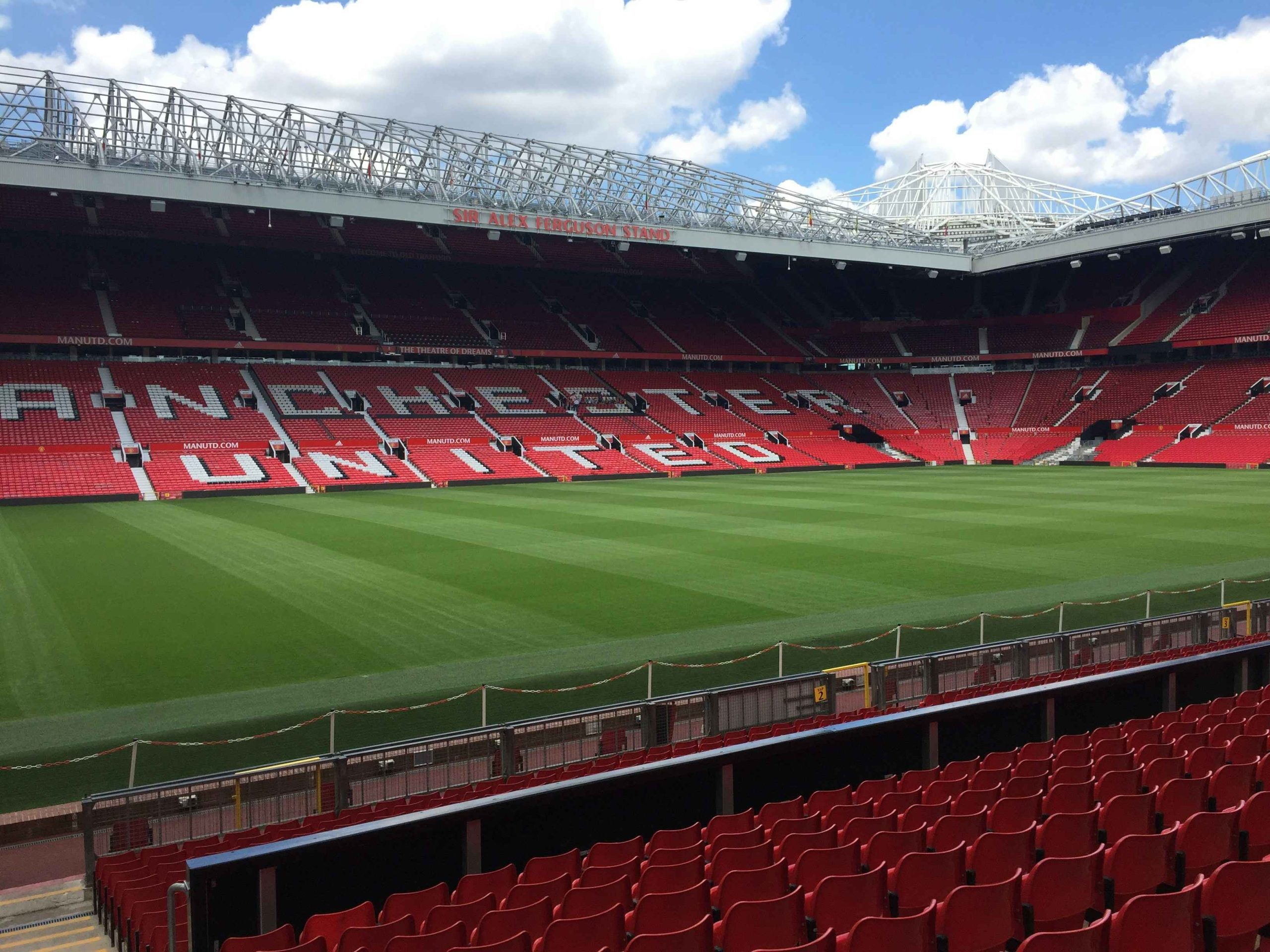 Old Trafford football stadium interior of the pitch and seating.